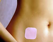 The conttaceptive patch on a woman's stomach birth control